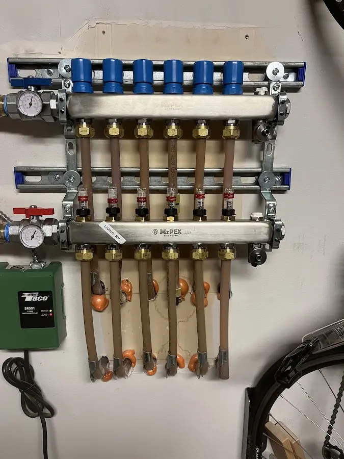 Plumber performing Water Heater Repair at a residential property in Livonia